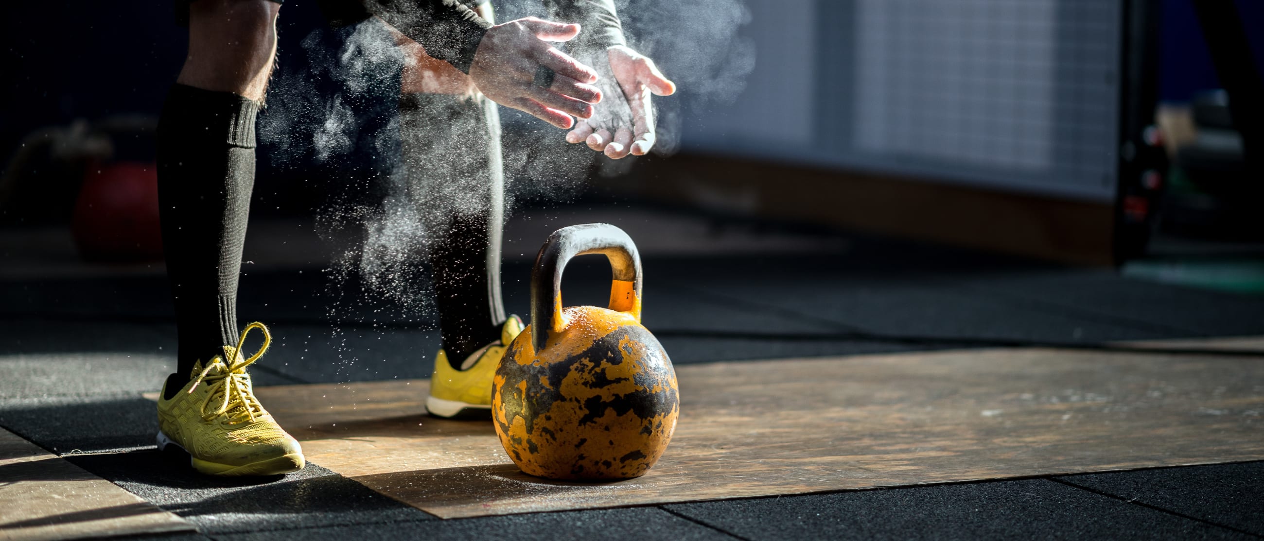 a gym member and a kettle bell